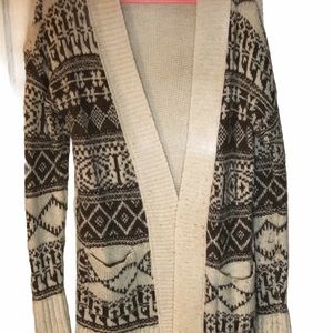 Large Creme Cardigan with Brown details.